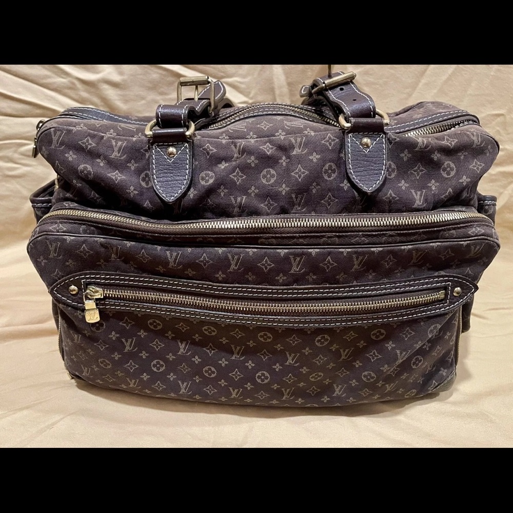 Brown Louis Vuitton bag can be used for traveling or as a baby bag